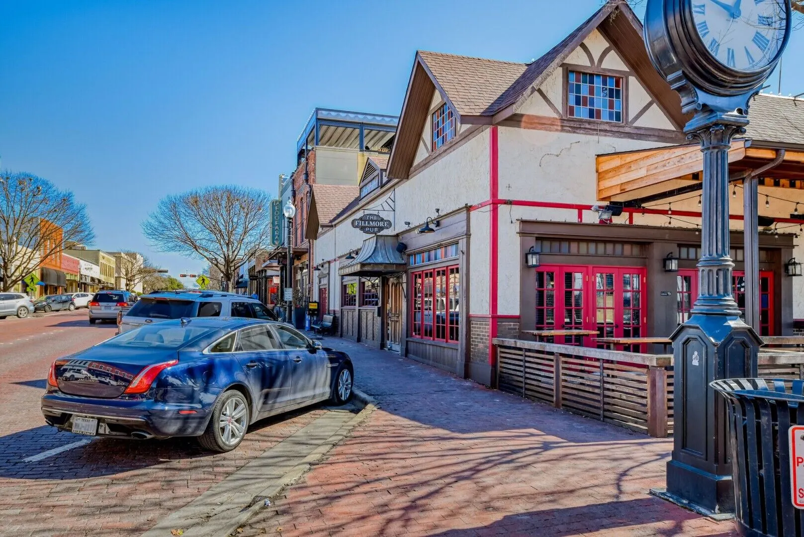 Storefronts and the street clock in downtown Plano